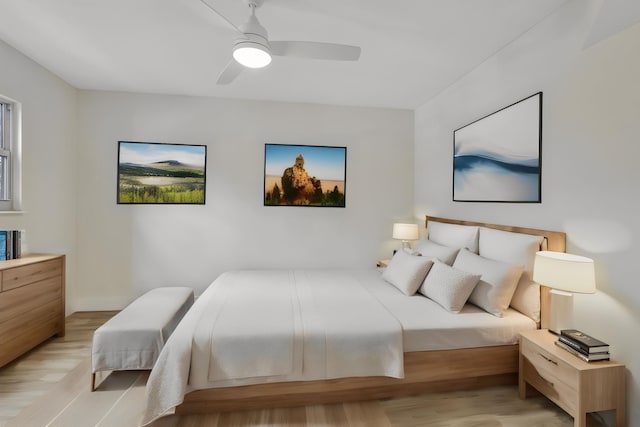 bedroom featuring ceiling fan and light hardwood / wood-style flooring