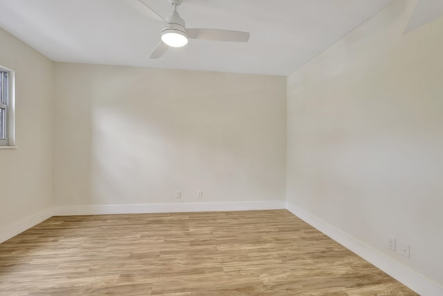 spare room with light hardwood / wood-style flooring and ceiling fan