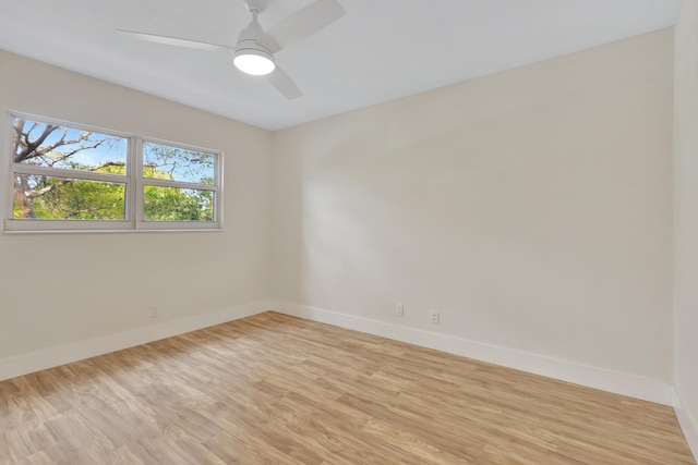 unfurnished room with light hardwood / wood-style flooring and ceiling fan