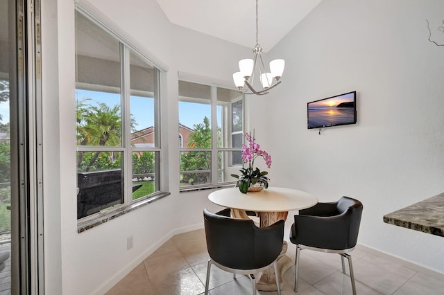 dining area featuring an inviting chandelier, light tile patterned floors, and a wealth of natural light