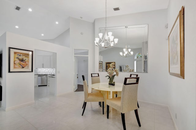 dining area with an inviting chandelier and light tile patterned floors