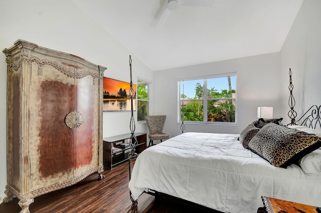 bedroom with lofted ceiling, ceiling fan, and dark hardwood / wood-style floors