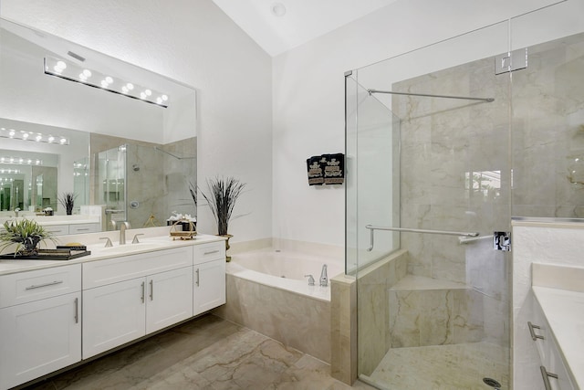 bathroom featuring vanity and separate shower and tub