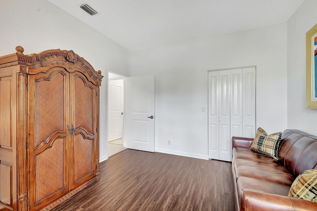 living room with dark hardwood / wood-style flooring