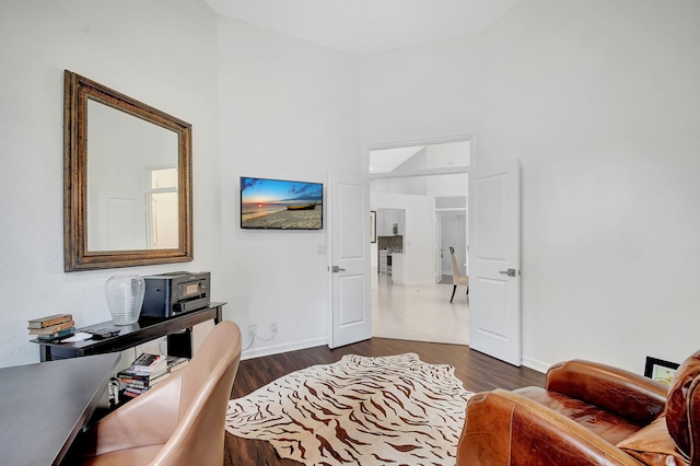 office with dark hardwood / wood-style flooring