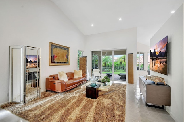 tiled living room featuring high vaulted ceiling