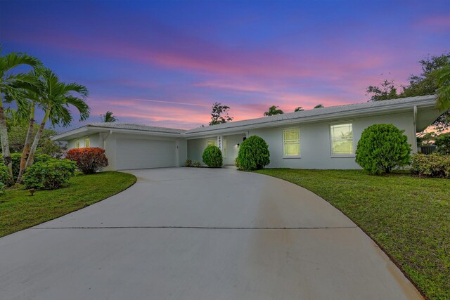 ranch-style house with a front lawn