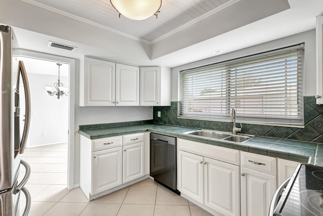 kitchen featuring ornamental molding, stainless steel appliances, light tile patterned floors, decorative backsplash, and white cabinets