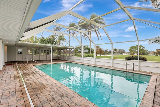 outdoor pool with a patio area and a lanai