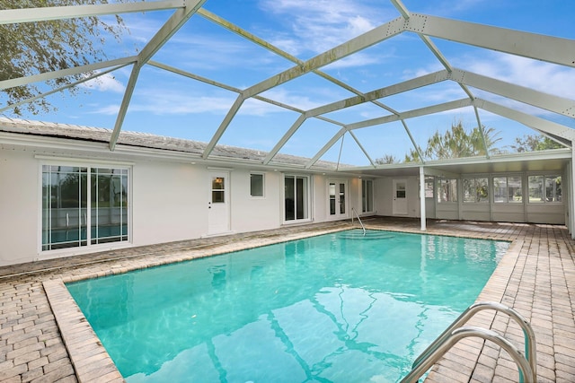 pool with a patio area and a lanai