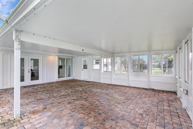 unfurnished sunroom featuring french doors