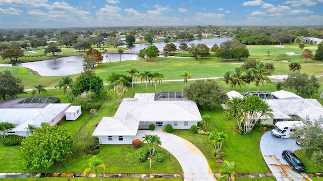 aerial view with a water view and view of golf course