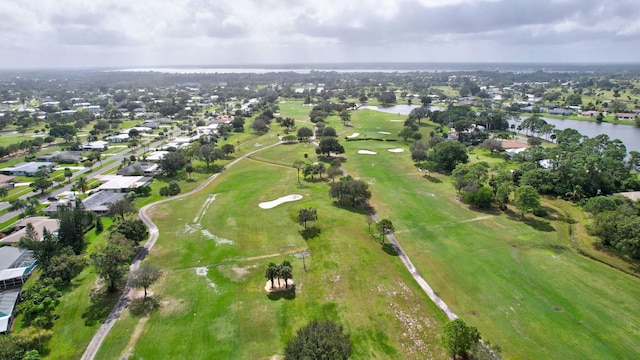 aerial view featuring a water view and golf course view