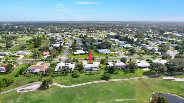 aerial view with a residential view and view of golf course