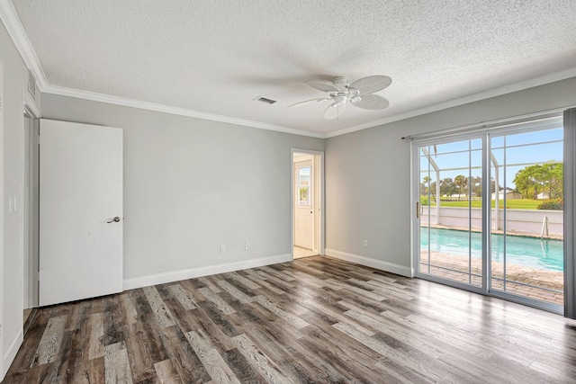 empty room featuring hardwood / wood-style floors, ceiling fan, a textured ceiling, and crown molding