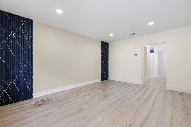 spare room featuring light hardwood / wood-style flooring