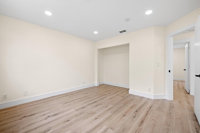 spare room featuring light hardwood / wood-style flooring