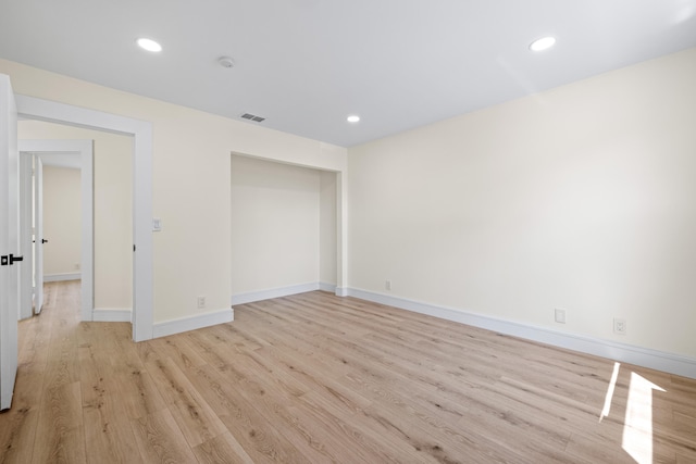 unfurnished room featuring light wood-type flooring