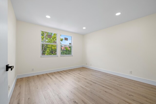 unfurnished room featuring light hardwood / wood-style floors