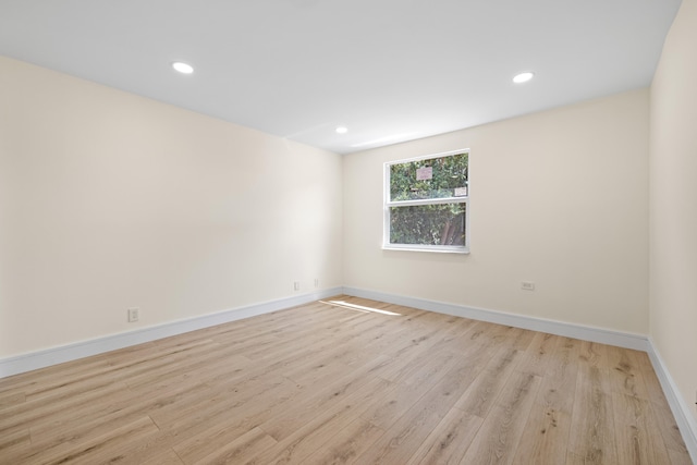 unfurnished room featuring light hardwood / wood-style flooring