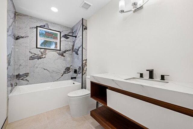 full bathroom featuring vanity, toilet, tile patterned floors, and tiled shower / bath