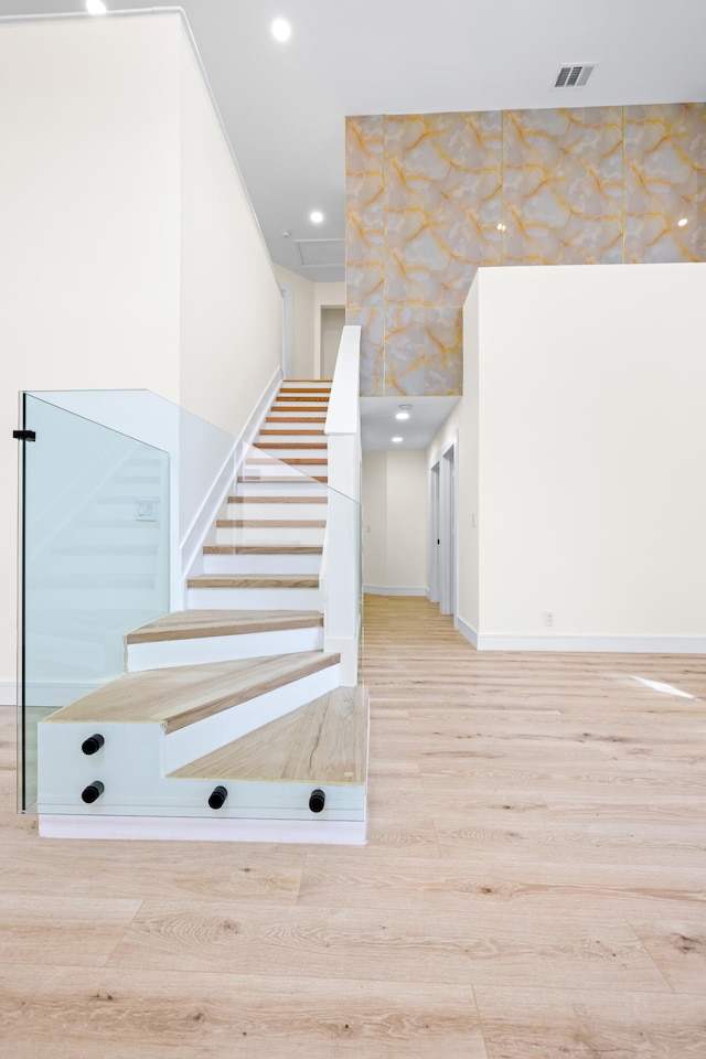 staircase featuring hardwood / wood-style flooring