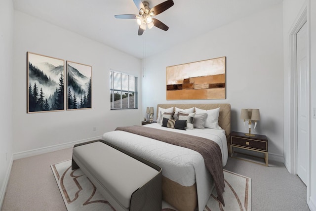 bedroom with carpet flooring, baseboards, and a ceiling fan
