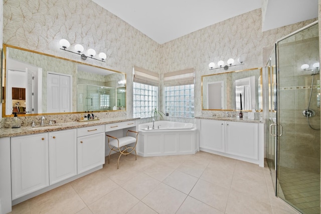 bathroom featuring tile patterned floors, separate shower and tub, and vanity