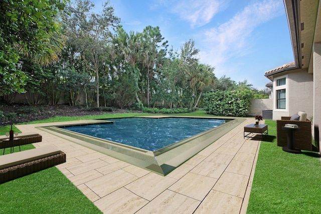 view of pool with a fenced backyard, a patio, a fenced in pool, and a yard
