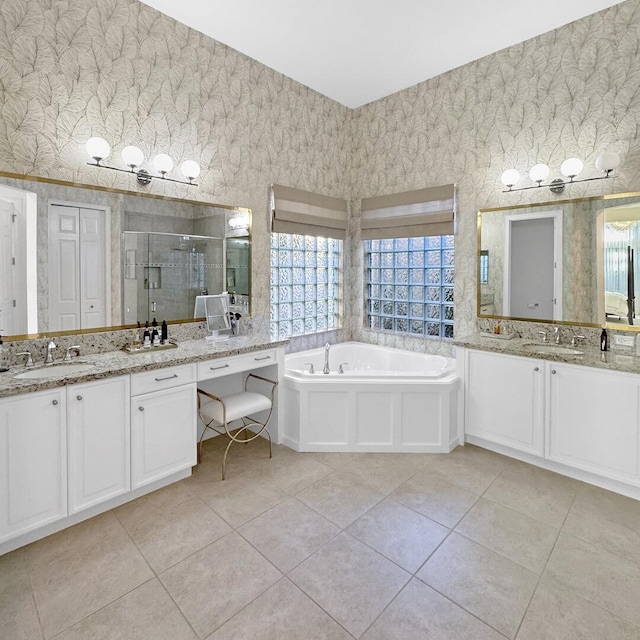 bathroom featuring vanity, independent shower and bath, and tile patterned flooring