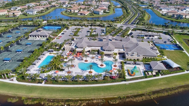 aerial view with a water view and a residential view