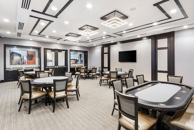 dining area featuring light carpet