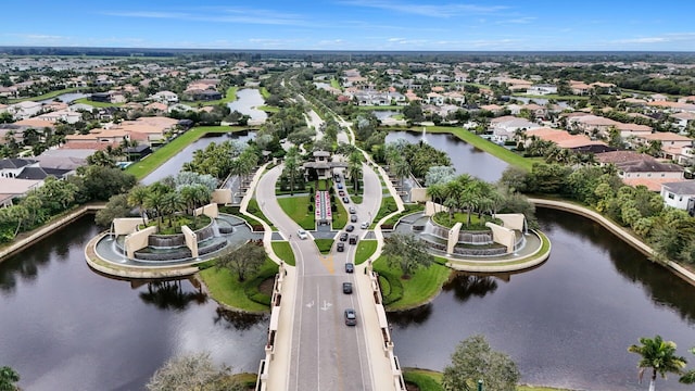 birds eye view of property featuring a water view and a residential view