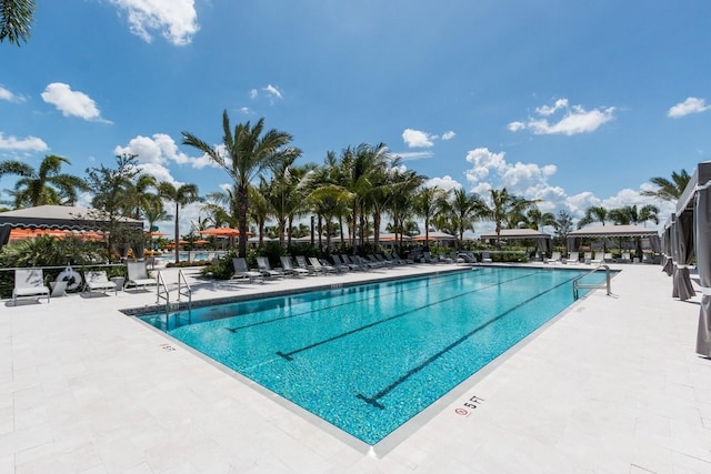 view of swimming pool featuring a gazebo and a patio area