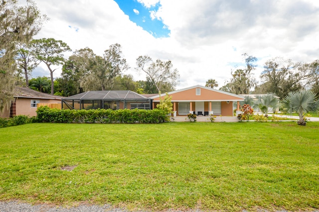 single story home featuring a front yard and glass enclosure