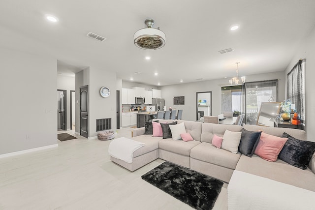 living room with a chandelier