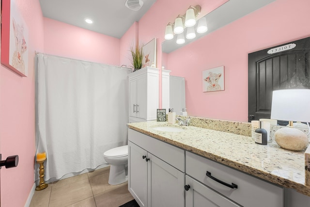 bathroom featuring curtained shower, tile patterned flooring, vanity, and toilet