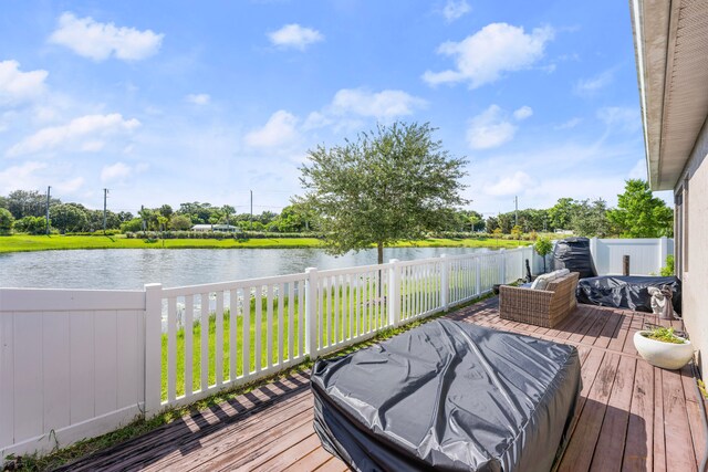 wooden terrace with a water view