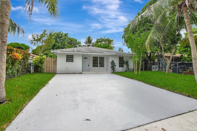 ranch-style home with a front yard