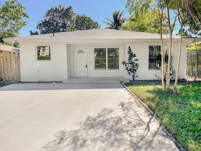 ranch-style home with a front yard