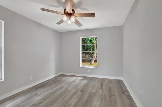 unfurnished room featuring ceiling fan and light hardwood / wood-style floors