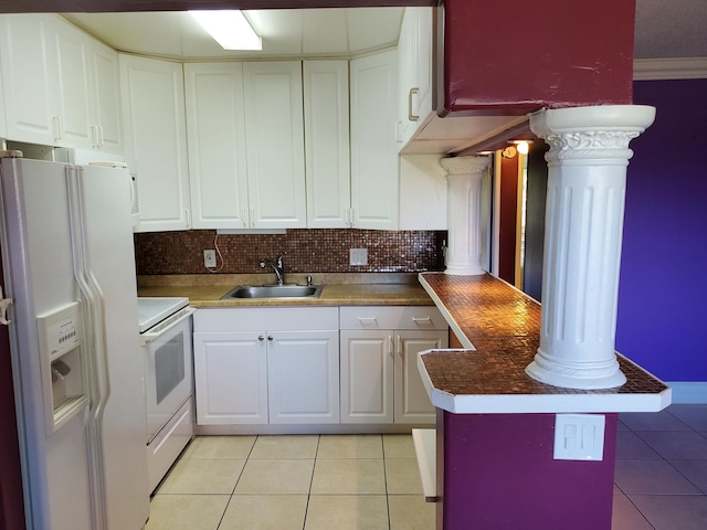 kitchen with ornamental molding, sink, white appliances, and white cabinetry