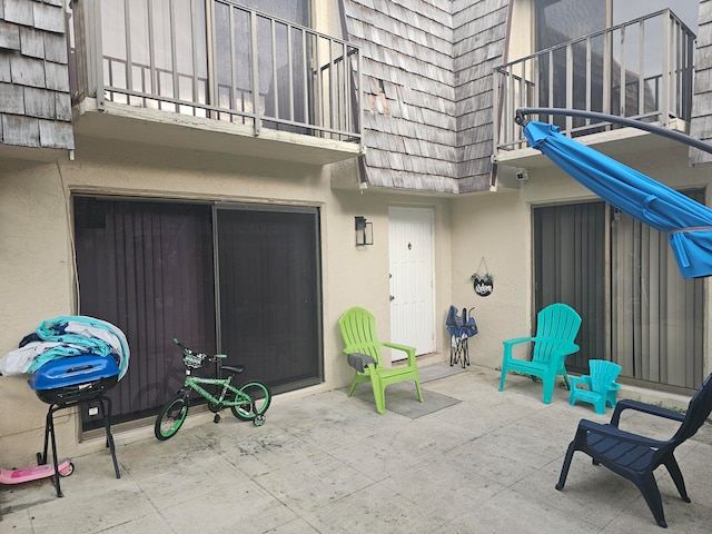 view of patio / terrace with a balcony