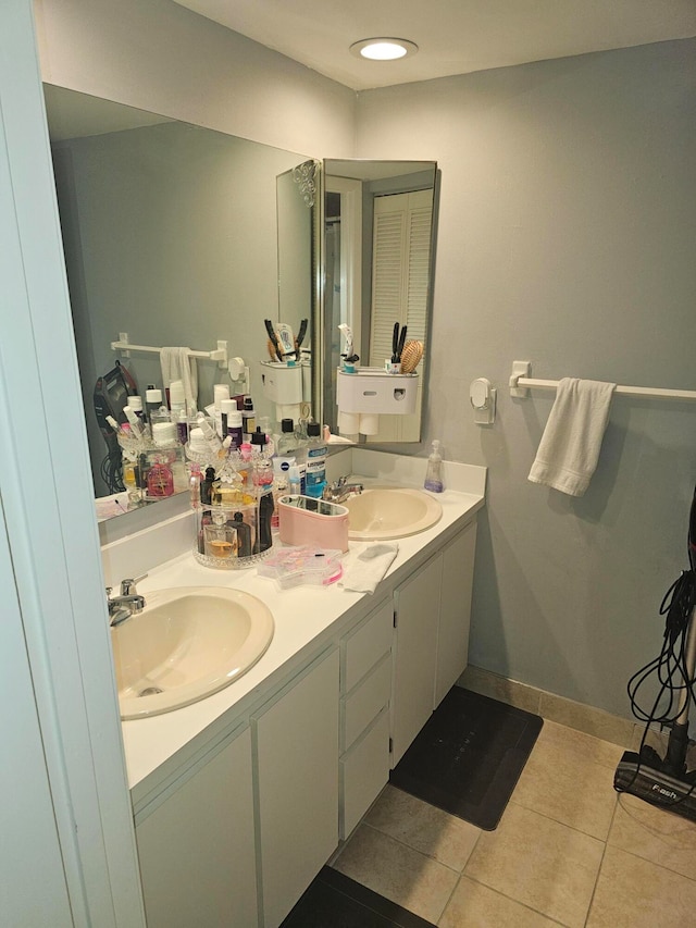 bathroom featuring tile patterned flooring and vanity