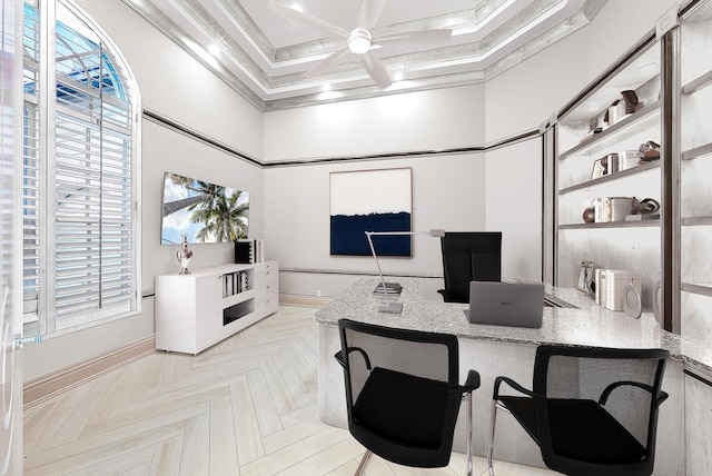 office space featuring ceiling fan, ornamental molding, coffered ceiling, and built in desk