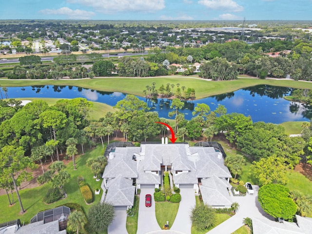 birds eye view of property with a water view