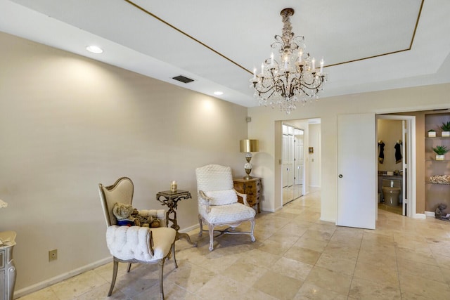 living area featuring a tray ceiling