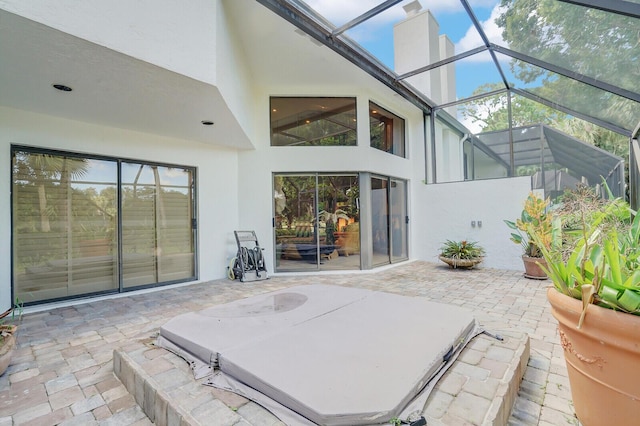 view of patio / terrace featuring a lanai