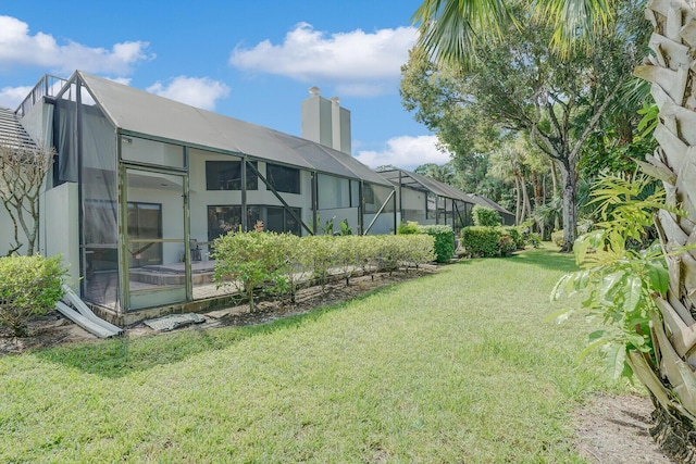 view of yard featuring a lanai