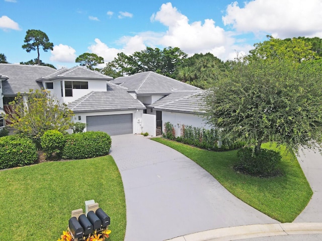 view of front facade with a garage and a front yard